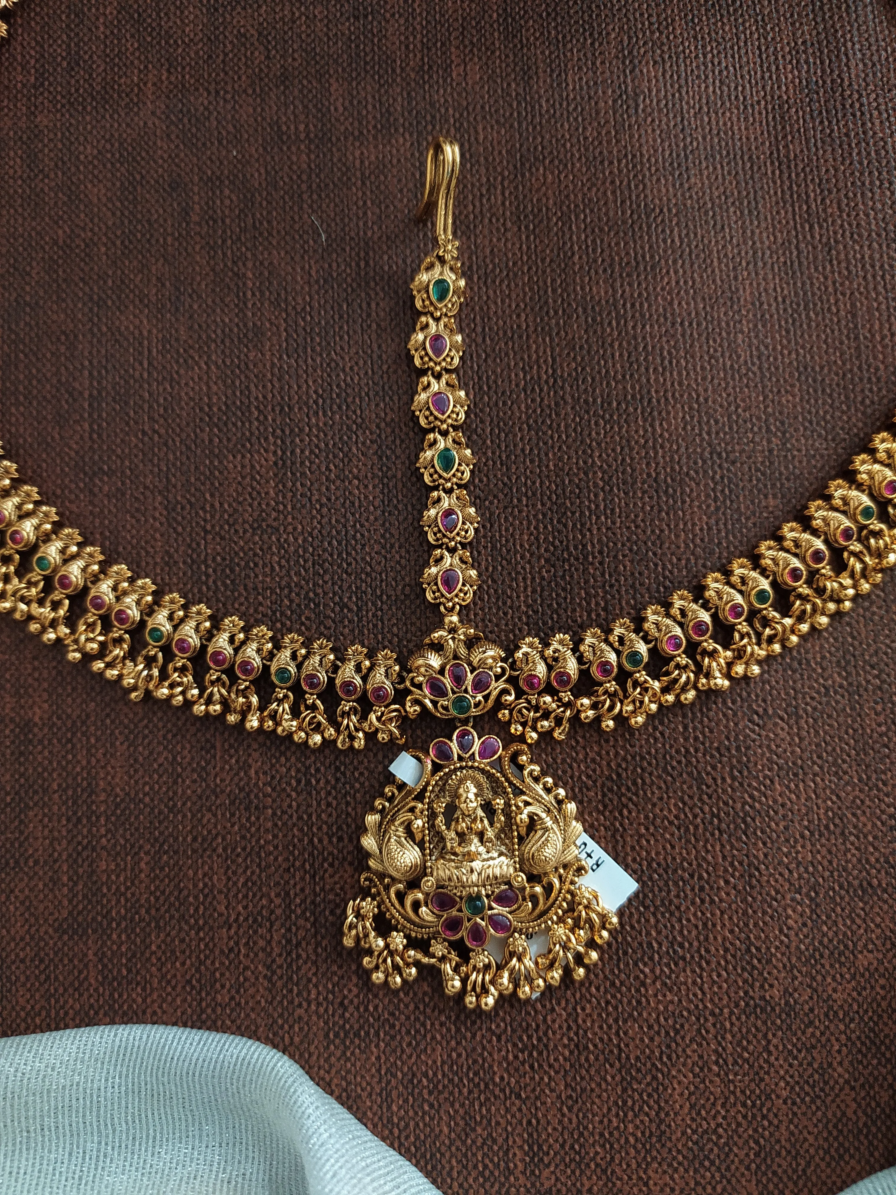 Antique Copper Finish Tikka Set with Lakshmi Motif and Golden Hangings